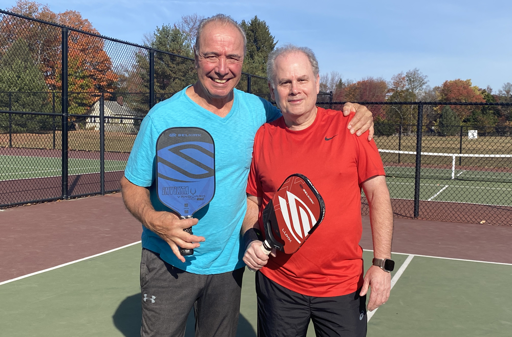 Ronnie Recchia, left, and Clyde Markowitz, MD, on the pickleball court, where they met in 2020.